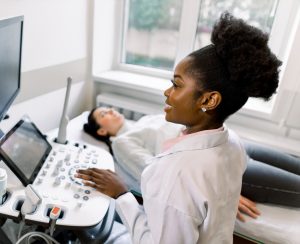 nurse giving a young woman an ultrasound