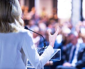 woman speaking at the podium